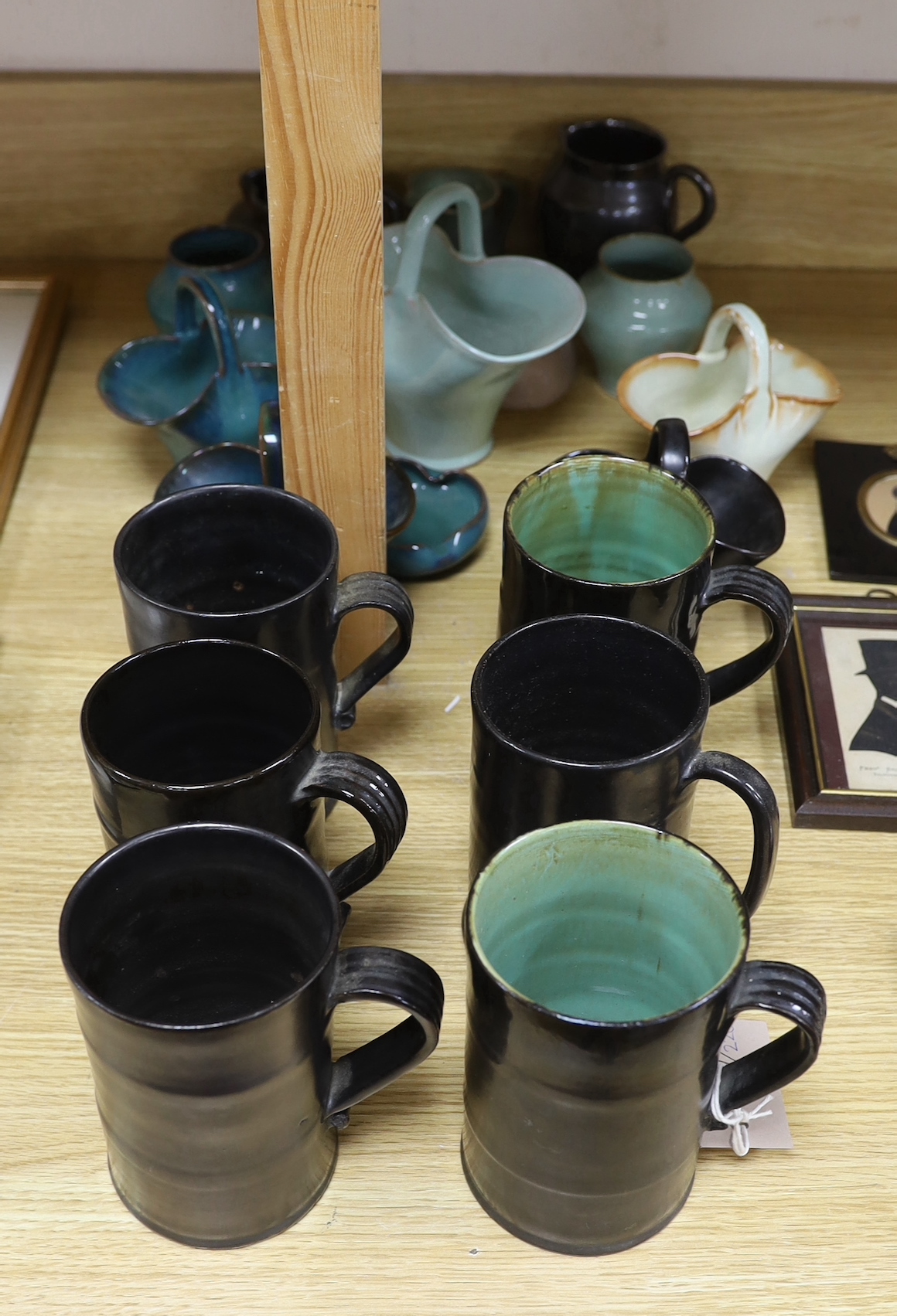 A collection of Dickerware pottery including mugs, baskets and jugs, the largest 14cm high